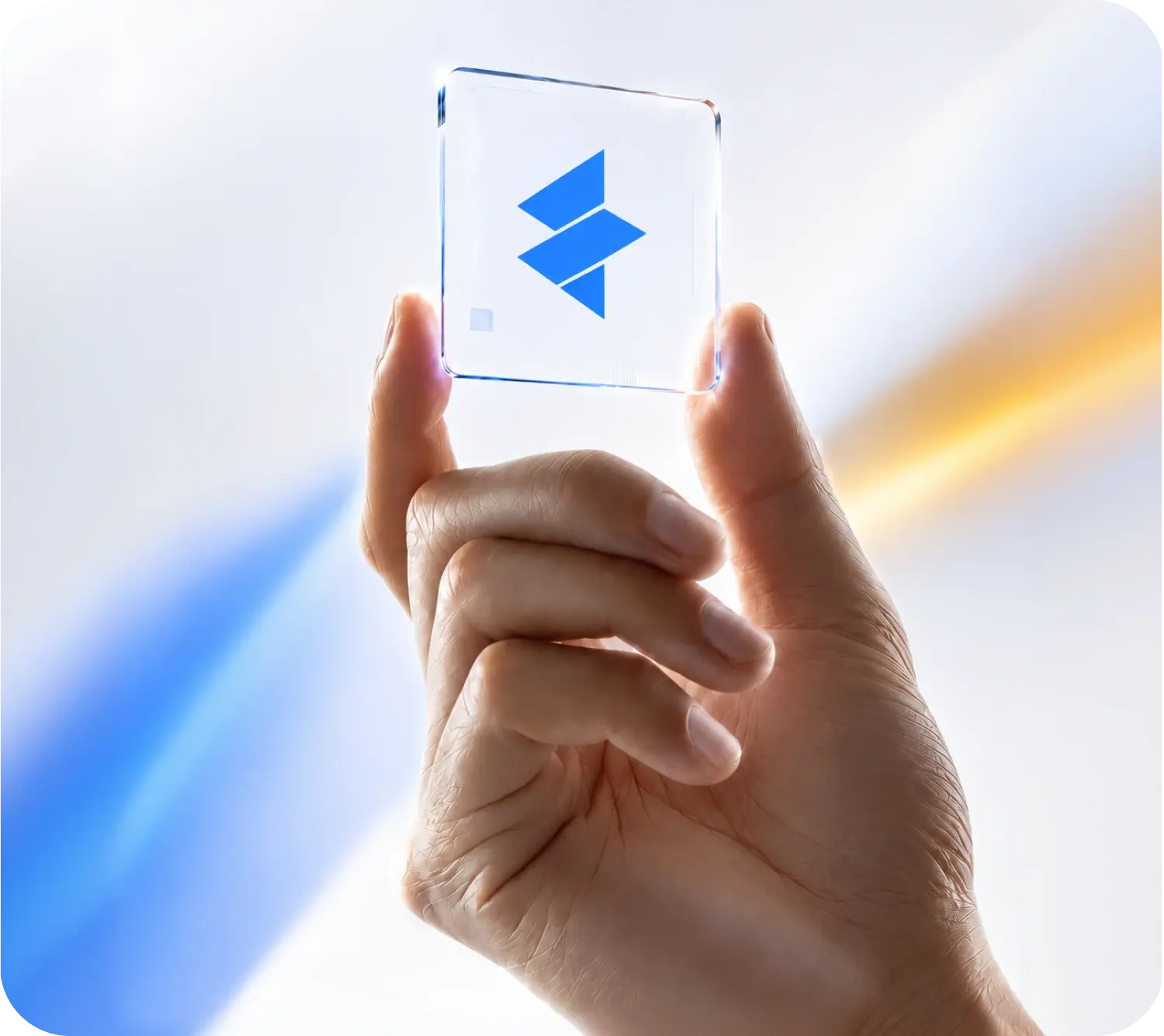 Hand holding a glass tile with the Employeeer logo